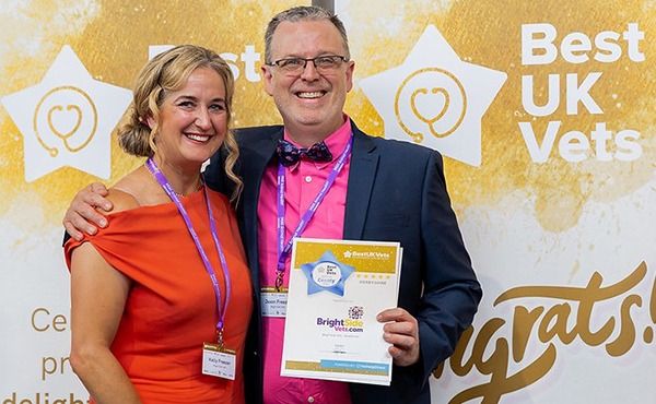 Jason and Kelly Freezer collect their BestUKVets award on behalf of Bright Side Vets